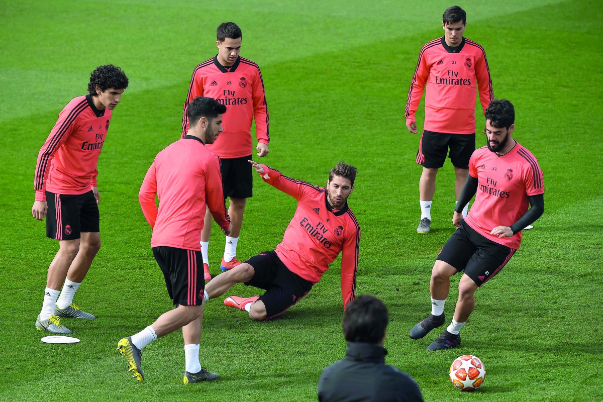 (L to R) Real Madrid's Spanish defender Jesus Vallejo, Real Madrid's Spanish midfielder Marco Asensio, Real Madrid's Spanish defender Sergio Reguilon, Real Madrid's Spanish defender Sergio Ramos, Real Madrid's Spanish midfielder Brahim Diaz and Real Madri