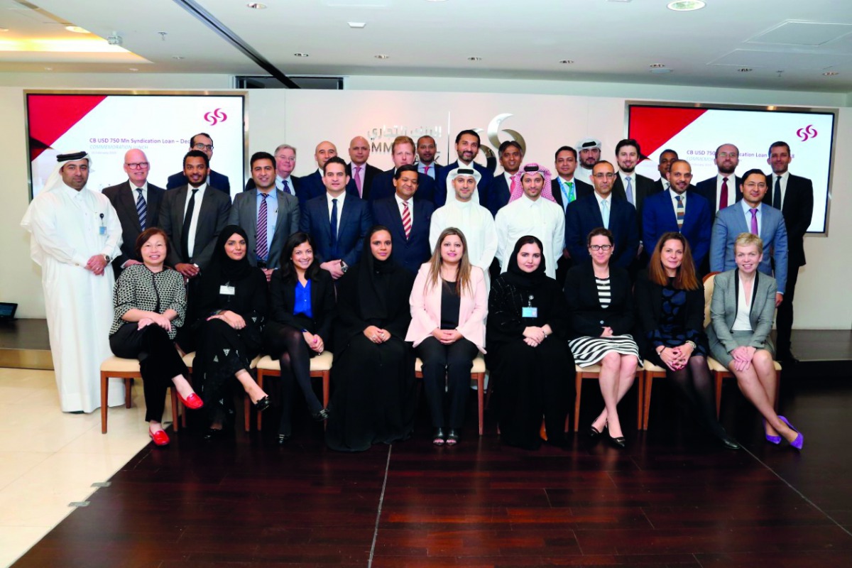 Commercial Bank officials and the guests on the sidelines of the event.