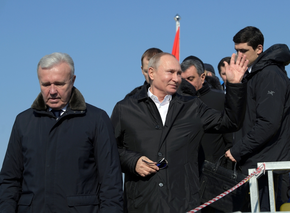Russian President Vladimir Putin waves at the 10 km men's cross-country skiing race at the 29th Winter Universiade in Krasnoyarsk, Russia March 3, 2019. Sputnik/Alexei Druzhinin/Kremlin via REUTERS.
