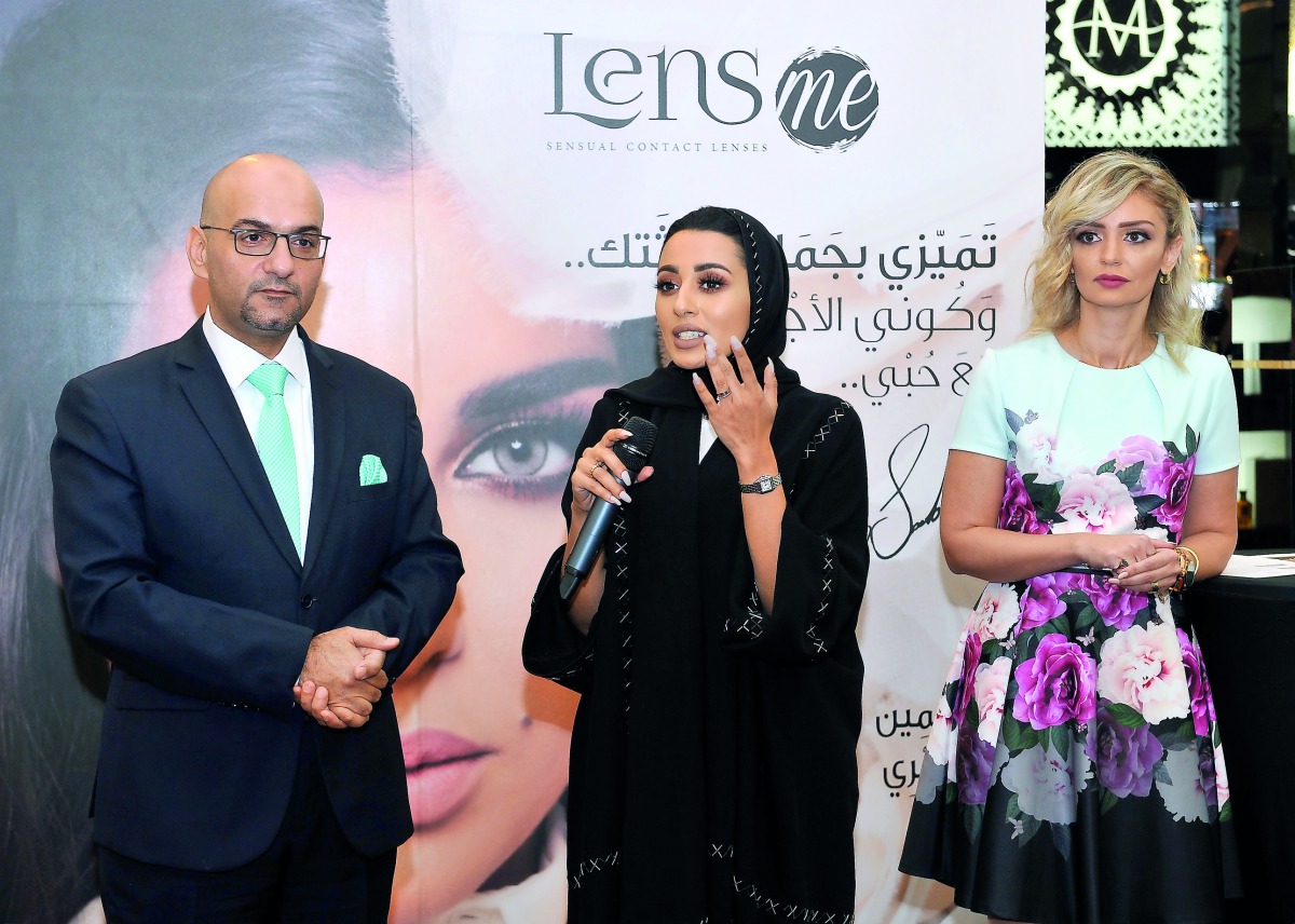 Hakam Al Qawasmi, General Manager of Pari Gallery, with Layal Yazbeck, Marketing Manager, 18th Avenue, and a guest at the event.  Pic: Salim Matramkot / The Peninsula
