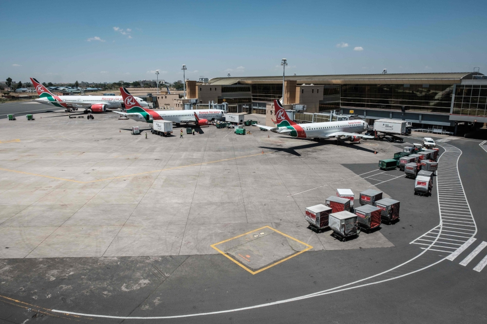 Aircrafts belonging to Kenya Airways are statione at the departure terminal during a strike by the airline workers at the Jomo Kenyatta International Airport in Nairobi on March 6, 2019.  AFP / Yasuyoshi CHIBA