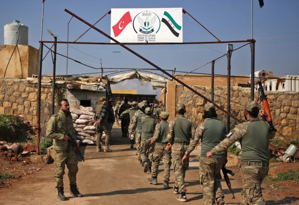 Turkish-backed fighters take part in a training at a military barracks, north of the Syrian town of Manbij on March 6, 2019. / AFP / Bakr ALKASEM