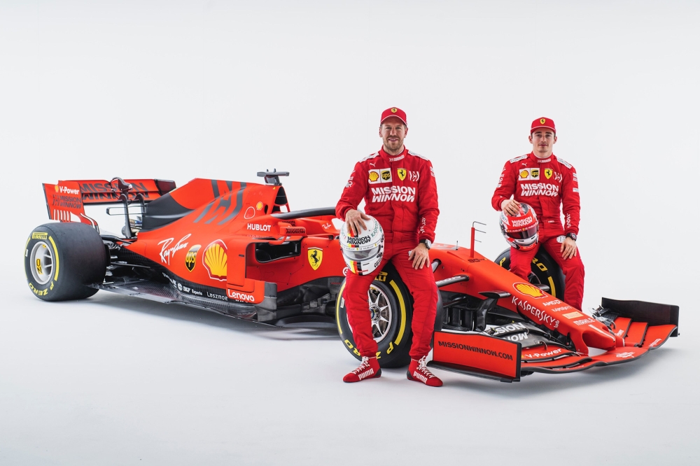 FILE PHOTO: Ferrari German Formula One driver Sebastian Vettel (C) and Ferrari Monagascan Formula One driver Charles Leclerc posing with the new Ferrari Formula One SF90.   AFP 