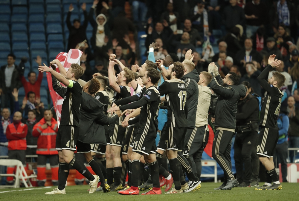 Players of Ajax celebrate after winning UEFA Champions League Round of 16-second leg match against Real Madrid at Santiago Bernabeu Stadium in Madrid, Spain on 5, 2019. Burak Akbulut - Anadolu