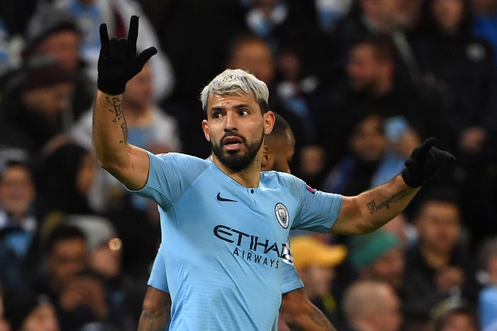 Manchester City's Argentinian striker Sergio Aguero celebrates after scoring their second goal during the UEFA Champions League round of 16 second leg football match between Manchester City and Schalke 04 at the Etihad Stadium in Manchester, north west En