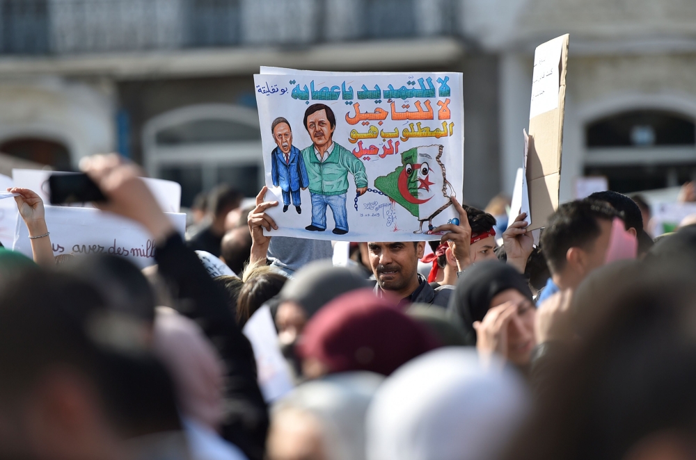 Algerian teachers and students protest in central Algiers on March 13, 2019 against President Abdelaziz Bouteflika's bid to prolong his two-decade rule. A thousand teachers started the protest in the morning before being joined by students, a teacher at t