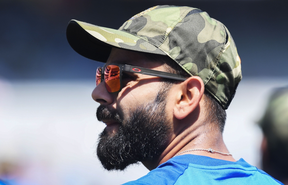 Indian cricket captain Virat Kohli looks on as he attends a training session.(AFP / DIBYANGSHU SARKAR)