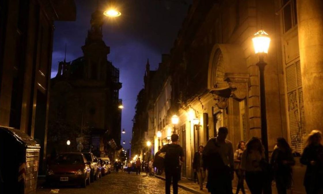 People walk on a street as lightning illuminates the sky in Buenos Aires, Argentina, October 18, 2017. Reuters/Marcos Brindicci