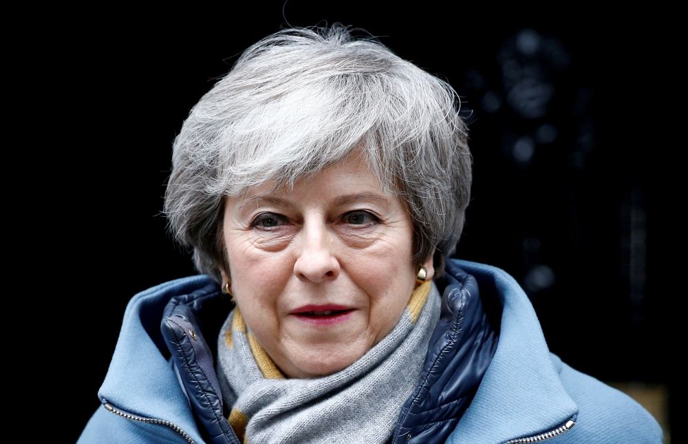 File photo of British Prime Minister Theresa May walks outside Downing Street, as she faces a vote on Brexit, in London, Britain March 13, 2019. REUTERS/Henry Nicholls/File Photo