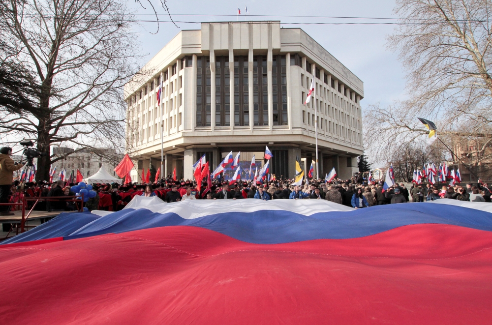 FILE PHOTO: People take part in celebrations of the fifth anniversary of Russia's annexation of Crimea in Simferopol, Crimea March 15, 2019. REUTERS/Alexey Pavlishak