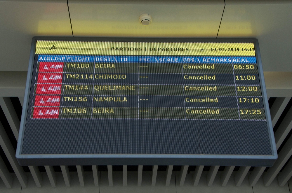 A Departures electronic panel indicating that all flights are cancelled is seen on March 14, 2019 at the Maputo International Airport in Mozambique. Mozambique suspended all domestic flights as it is hit by the largest cyclone in decade.   AFP / EMIDIO JO