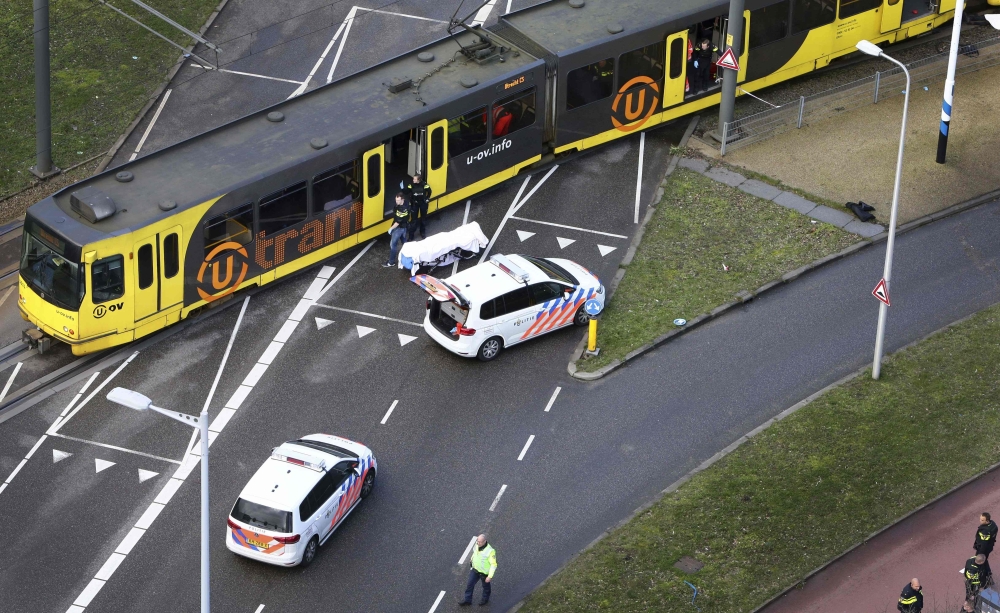 Special Police forces inspect a tram at the 24 Oktoberplace in Utrecht, on March 18, 2019 where a shooting took place.  AFP /  Ricardo Smit
