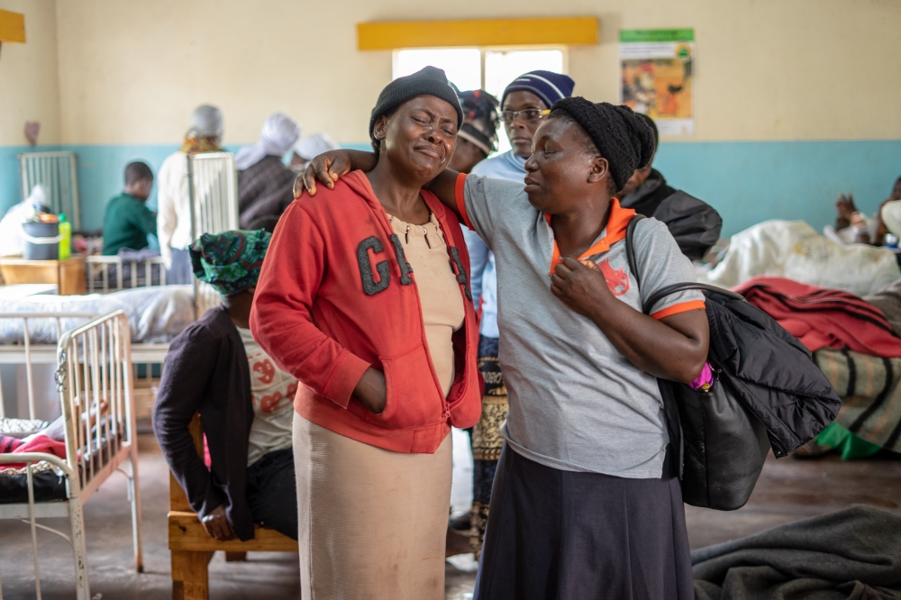 Family members react to a child with broken limbs at Chimanimani Rural district hospital, Manicaland Province, eastern Zimbabwe, on March 18 2019, after the area was hit by the cyclone Idai. AFP/Zinyange Auntony 