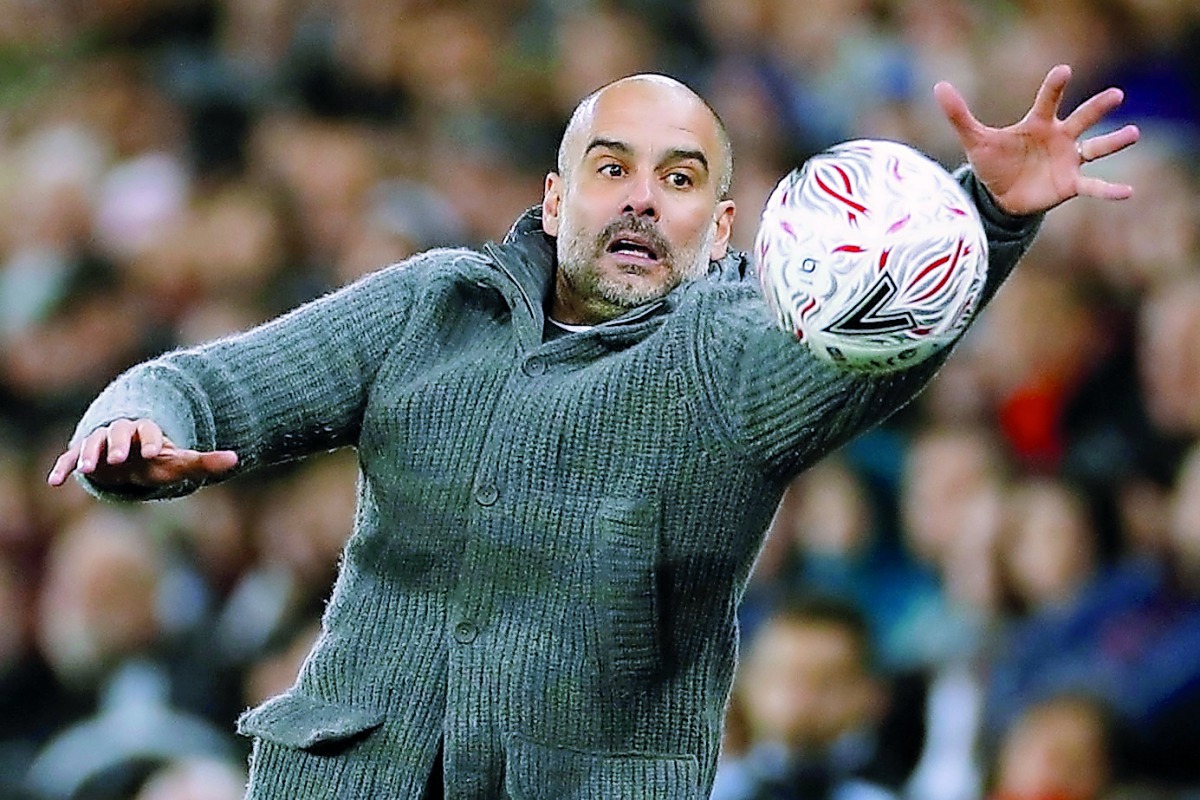 Manchester City manager Pep Guardiola with the match ball, Liberty Stadium, Swansea, Britain - March 16, 2019 (Action Images via Reuters/John Sibley)