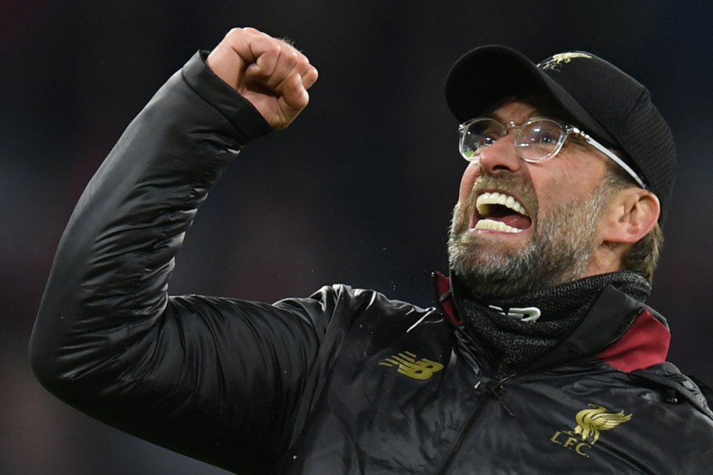 Liverpool's German manager Jurgen Klopp celebrates after the UEFA Champions League, last 16, second leg football match Bayern Munich v Liverpool in Munich, southern Germany, on March 13, 2019. AFP / Christof Stache 