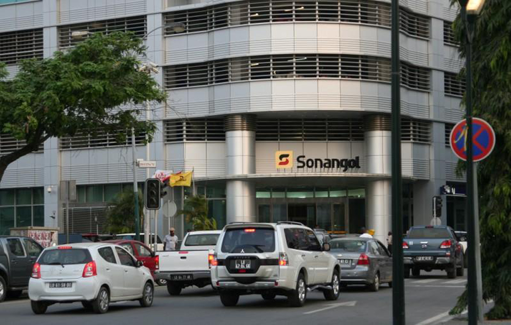 FILE PHOTO: Cars are seen infront of the head office of Angola's state oil company Sonangol in the capital Luanda, Angola June 7,2016. REUTERS
