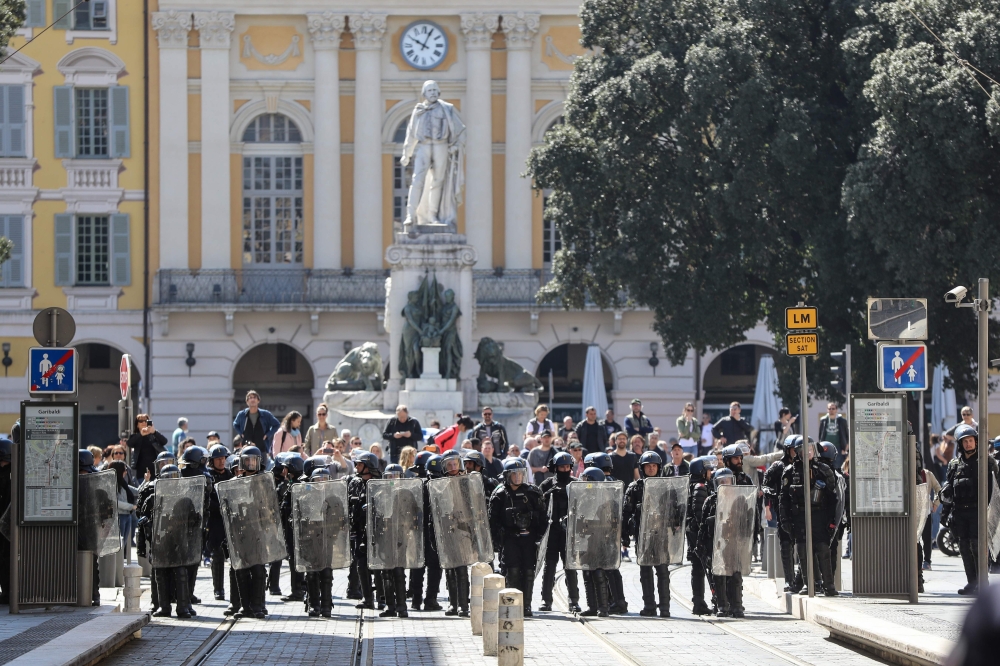Anti-riot police officers block an access to Garibaldi Square in downtown Nice, on the sidelines of an anti-government demonstration called by the 