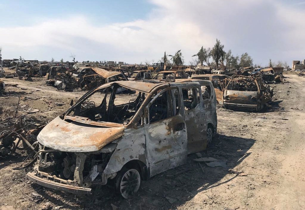 A view of burnt vehicles after the U.S.-backed forces said they had captured Islamic State's last shred of territory, in the village of Baghouz, Deir Al Zor province, Syria, March 23, 2019. REUTERS