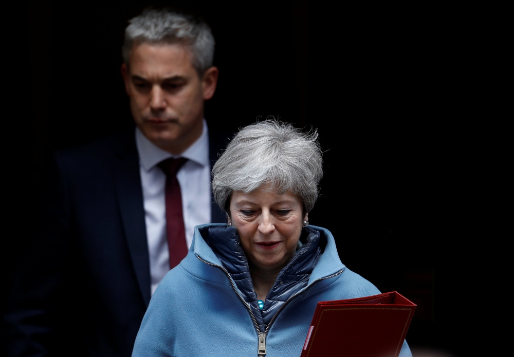 Britain's Prime Minister Theresa May and Britain's Secretary of State for Exiting the European Union Stephen Barclay are seen outside Downing Street in London, Britain, March 25, 2019. REUTERS/Peter Nicholls