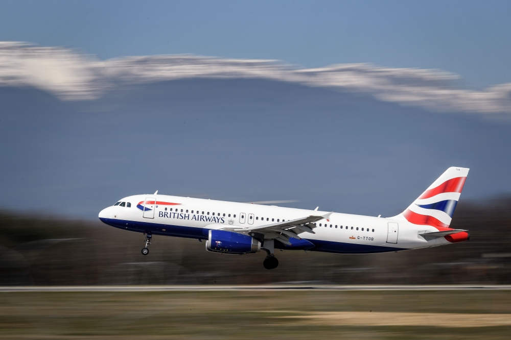 A British Airways Airbus A320 commercial plane with registration G-TTOB is landing at Geneva Airport on March 22, 2019 in Geneva. AFP / Fabrice Coffrini