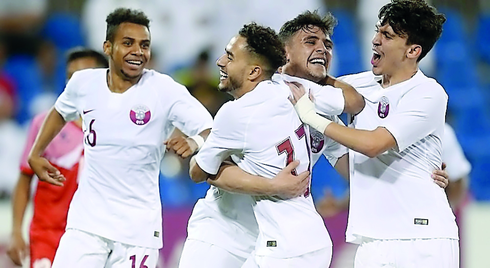 Qatari players celebrate after qualifying for the AFC U-23 Championship Thailand 2020 with a two-all draw against Oman at the Aspire Pitch in Doha, yesterday.