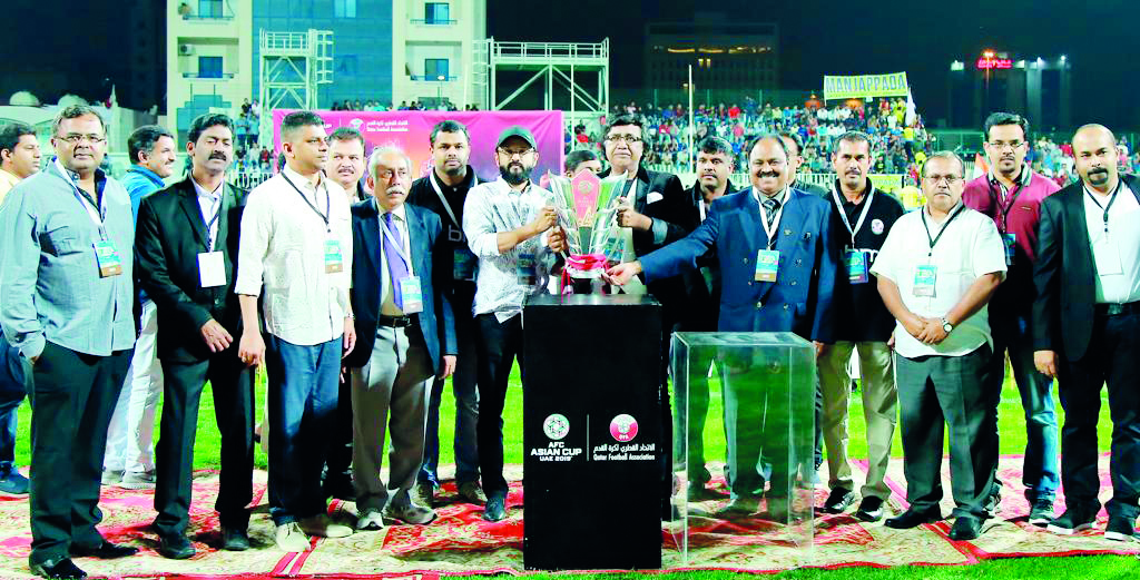 The officials posing for a group picture.