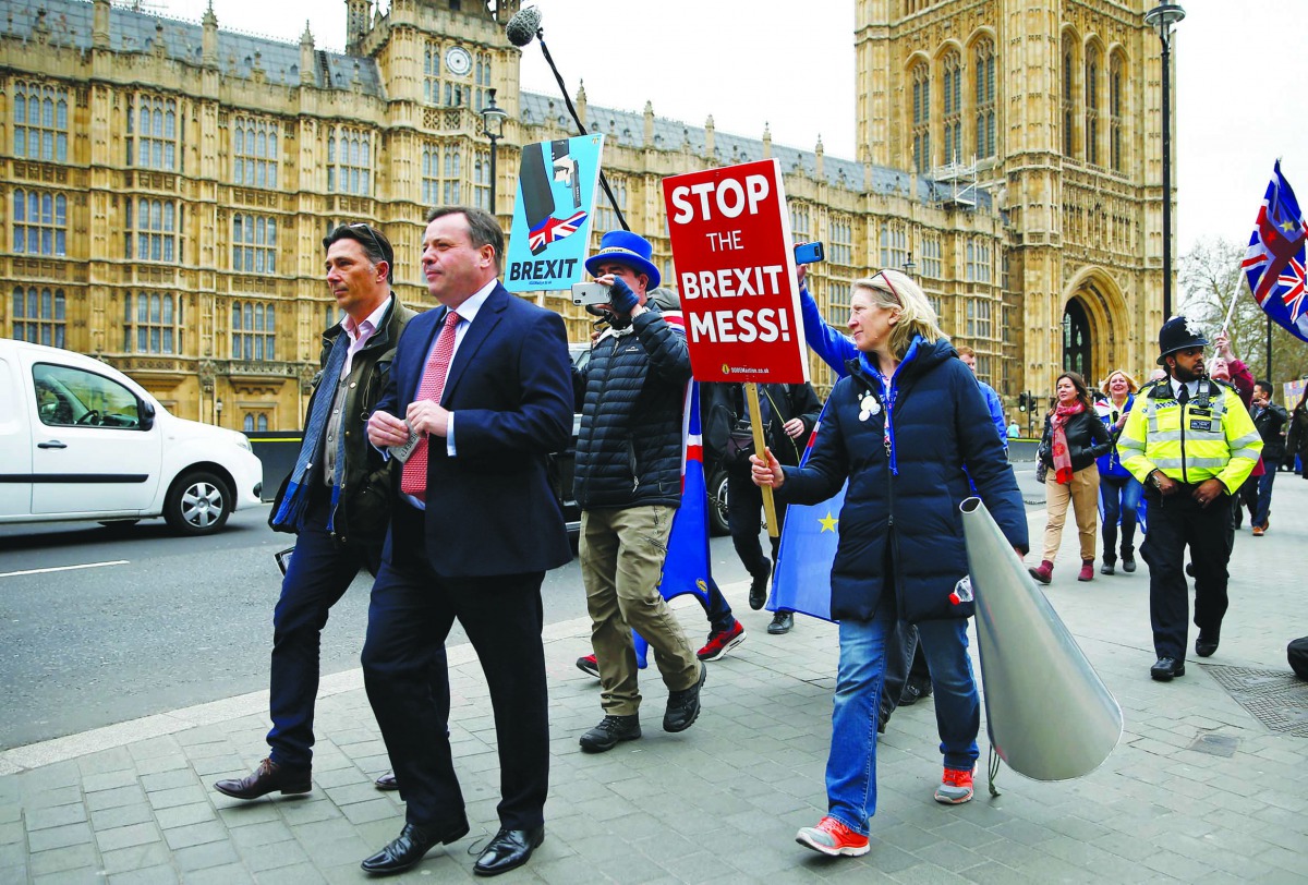 British businessman and co-founder of the Leave.EU campaign Arron Banks walks past anti-Brexit protesters outside the Houses of Parliament in London, March 27, 2019. Reuters/Henry Nicholls