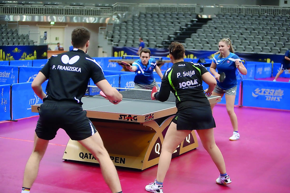 Germany’s Patrick Franziska and Petrissa Solja in action  against their Slovak counterparts Samuel Kaluzny and Tatiana Kukulkova during their Mixed doubles Preliminary Round match yesterday. 