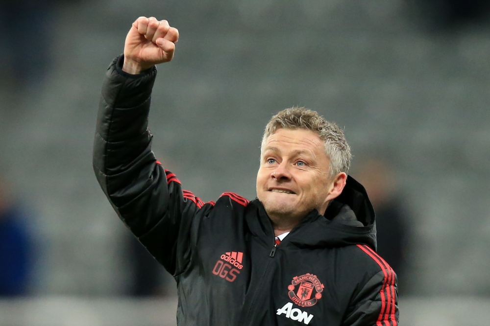 (FILES) In this file photo taken on January 02, 2019, Manchester United's Norwegian caretaker manager Ole Gunnar Solskjaer applauds the fans following the English Premier League football match between Newcastle United and Manchester United at St James' Pa