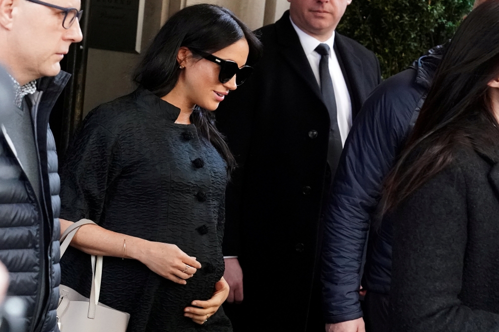 Meghan Markle, Duchess of Sussex, exits a hotel in the Manhattan borough of New York City,  Feb.19, 2019. Reuters/Carlo Allegri