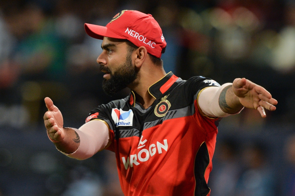 Royal Challengers Bangalore captain Virat Kohli gestures during the 2019 Indian Premier League (IPL) Twenty20 cricket match between Royal Challengers Bangalore and Mumbai Indians at The M. Chinnaswamy Stadium in Bangalore on March 28, 2019. / AFP / Manjun