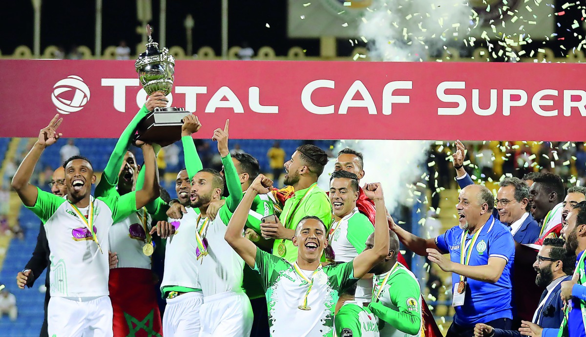Raja Casablanca players celebrate after winning the African Super Cup final against Esperance Sportive de Tunis at the Thani bin Jassim Stadium, in Doha, yesterday. Picture: Mohamed Farag