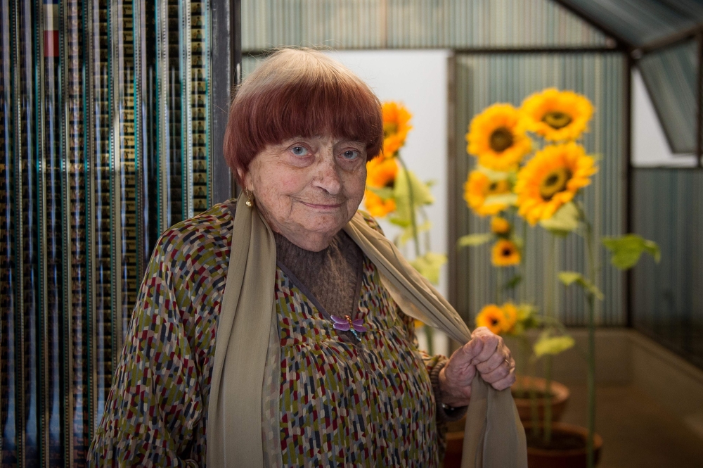 French artist Agnes Varda poses next to her installation named 
