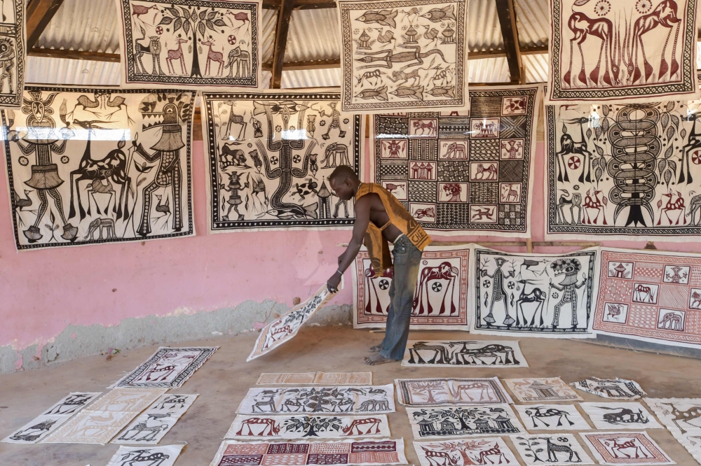 An artist displays his paintings in his workshop, in the village of Fakaha, a remote village in northern Ivory Coast, some 650 kilometres (400 miles) from Abidjan on January 24, 2019. AFP / Sia Kambou