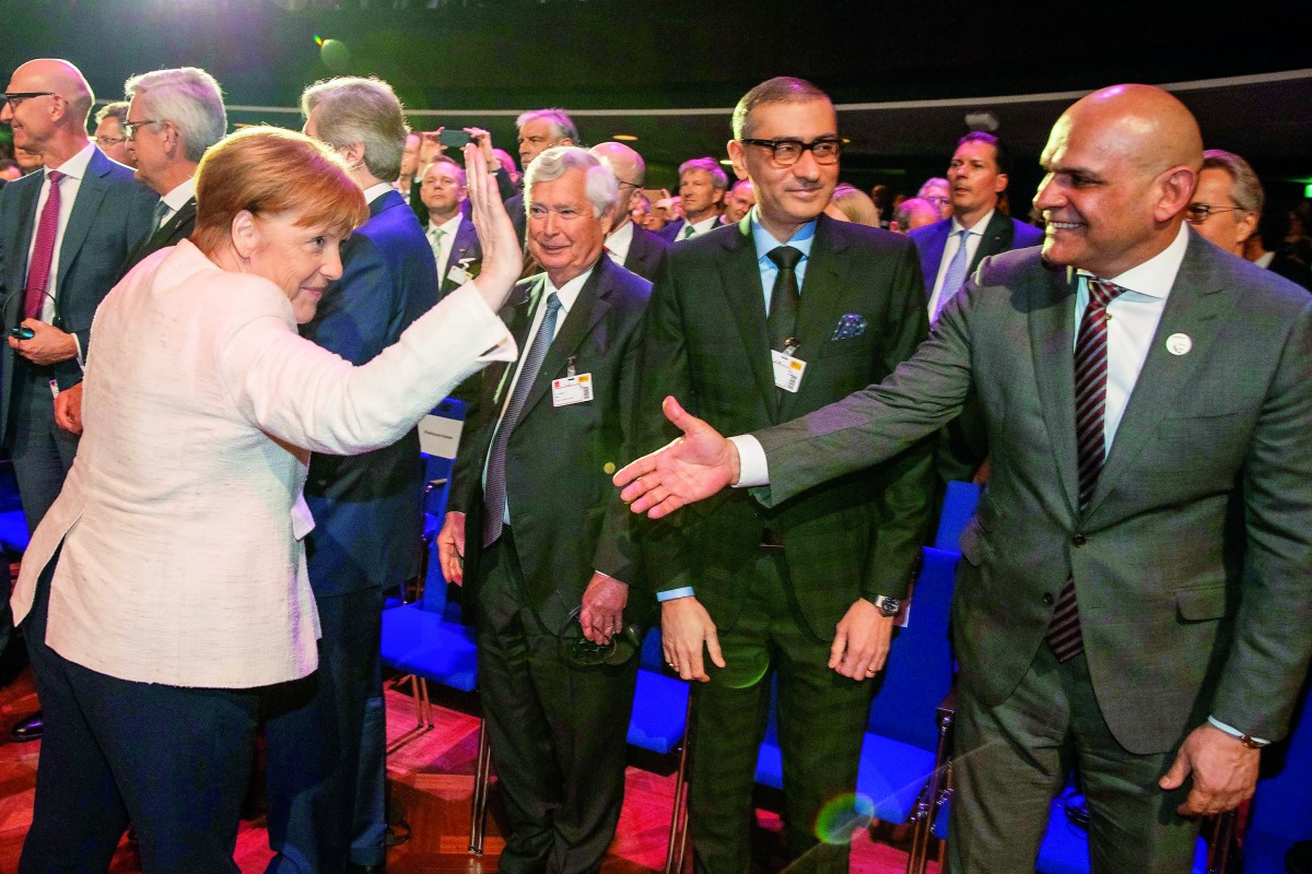 German Chancellor Angela Merkel greets guests as she arrives to the opening ceremony of the Hanover Fair on March 31, 2019 in Hanover, Germany. The Hanover technology fair runs until April 05, 2019, with Sweden as partner country. AFP / DPA / Friso Gentsc