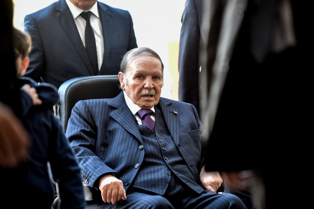 In this file photo taken on November 23, 2017 Algerian President Abdelaziz Bouteflika is seen while voting at a polling station in the capital Algiers during polls for local elections. AFP/Ryad Kramdi