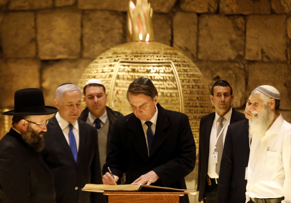 Brazilian President Jair Bolsonaro with Israeli Prime Minister Benjamin Netanyahu, during a visit to a synagogue inside the Western Wall Tunnels in Jerusalem's Old City April 1, 2019. Menahem Kahana/Reuters
