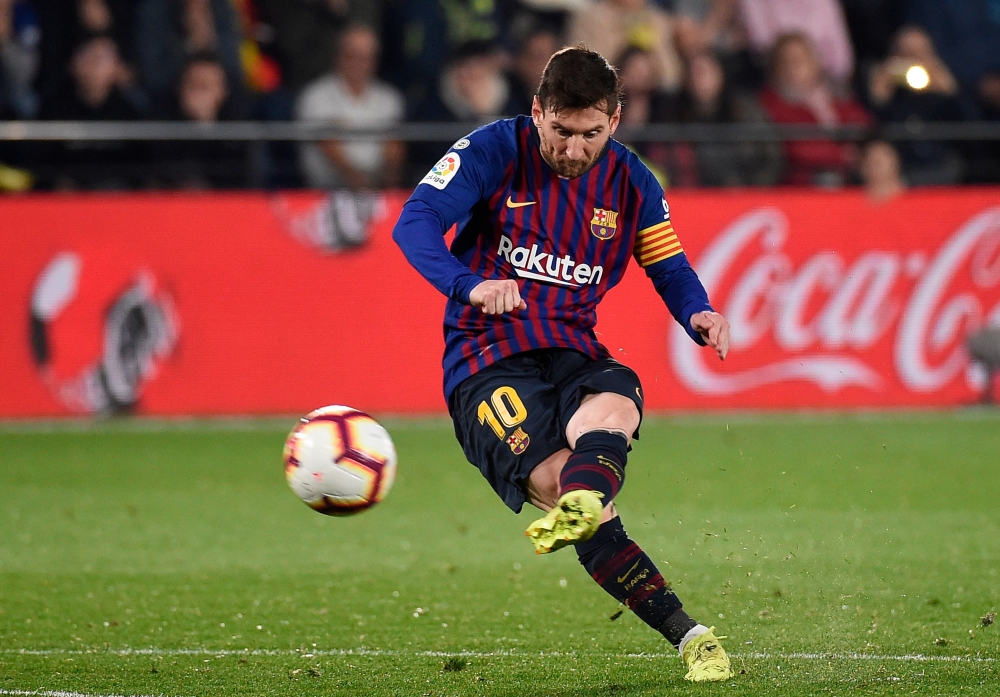 Barcelona's Argentinian forward Lionel Messi scores during the Spanish league football match Villarreal CF against Barcelona at La Ceramica stadium in Vila-real on April 2, 2019. / AFP / JOSE JORDAN
