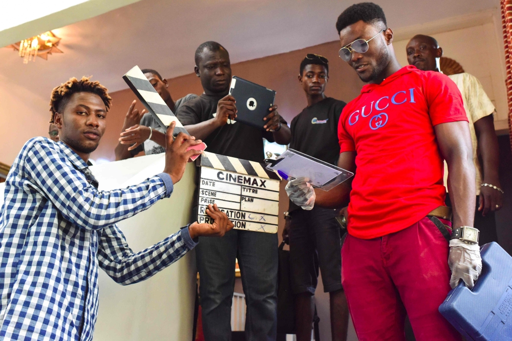 Participants pose during a workshop about filming with a smart-phone on March 30, 2019 as part of the 2nd edition of the Bushman Film Festival, the first Francophone film festival in West Africa focused of smart-phone filming, in Abidjan. AFP / Issouf San