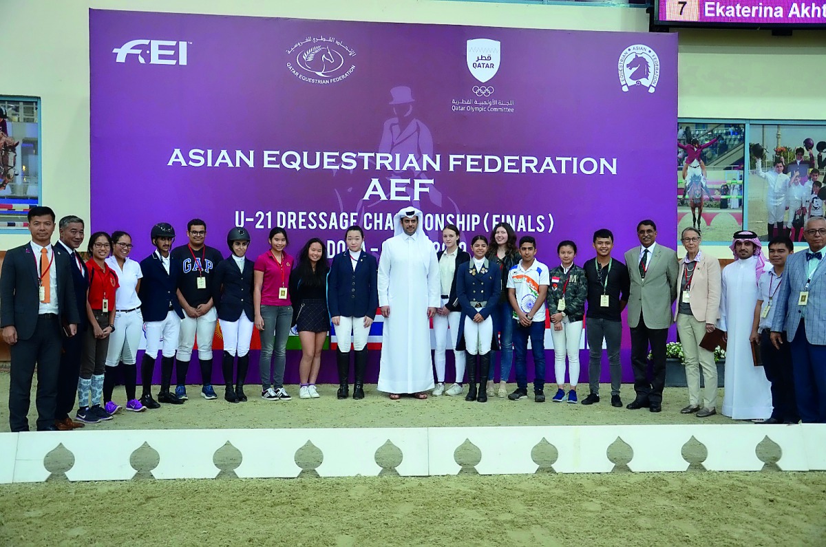 The President of Qatar and Asian Equestrian Federations, Hamad bin Abdul Rahman Al Attiyah, QEF’s Secretary-General, Bader Al Darwish, participating riders, coaches and AEF officials pose for a photograph during the AEF U-21 Dressage Championship Finals a