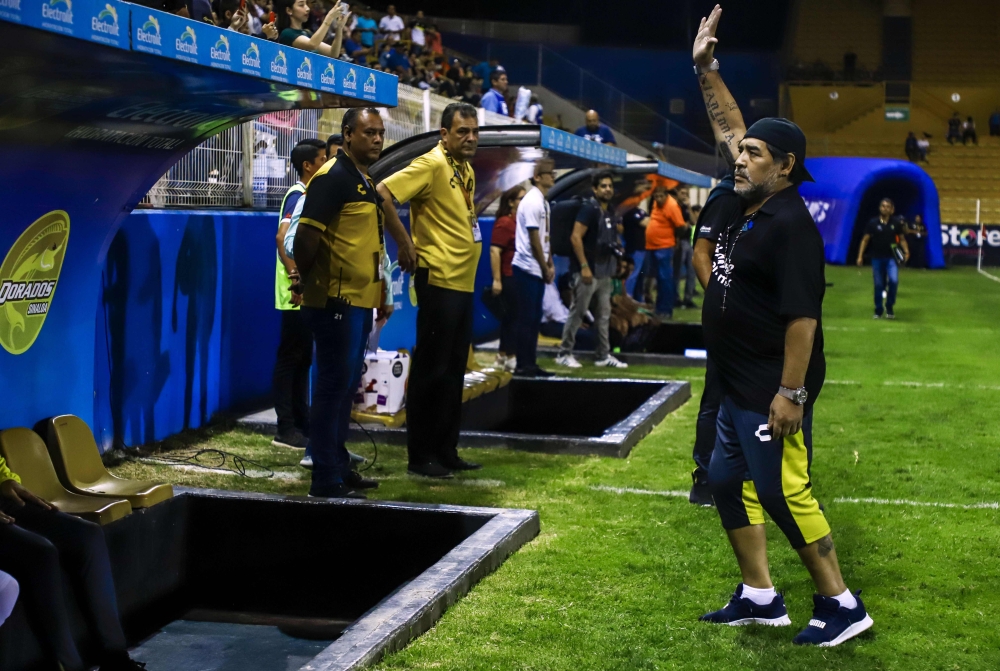Argentine legend Diego Maradona, coach of Mexican second-division club Dorados, gestures during a football match against Venados de Merida, in Culiacan, Sinaloa State, Mexico, on April 5, 2019. / AFP / RASHIDE FRIAS