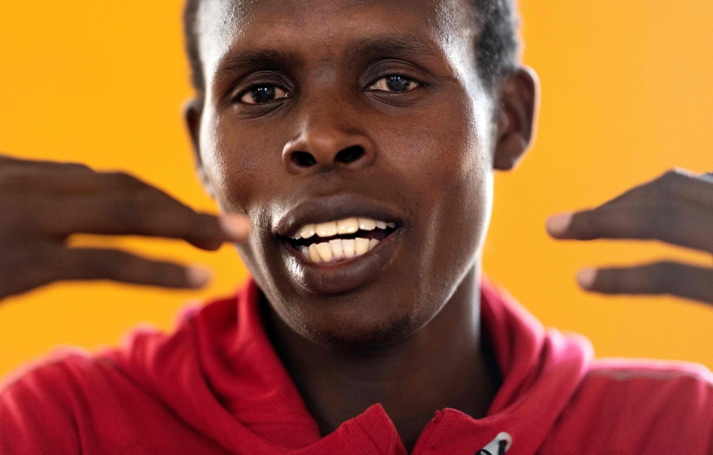 Kenya's runner Paul Lonyangata, who is aiming to become the first three-time winner of the Paris Marathon, answers journalists questions on March 14, 2019 in Kaptagat, a training camp for Kenyan runners in the Kenyan mountains. AFP / Franck Fife
 