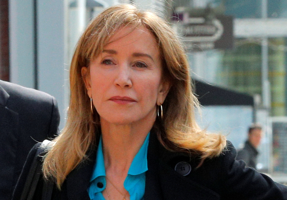 Actor Felicity Huffman, facing charges in a nationwide college admissions cheating scheme, enters federal court in Boston, Massachusetts, U.S., April 3, 2019. Reuters/Brian Snyder