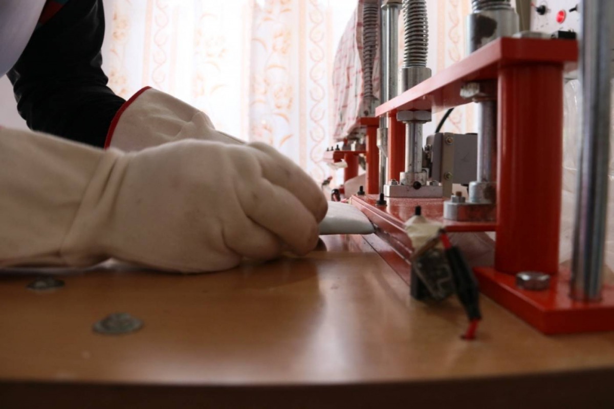 A woman makes a sanitary pad at the Sinidu Factory in Kithulwatte, Colombo, Sri Lanka, on March 13, 2019. Thomson Reuters Foundation/Smriti Daniel 