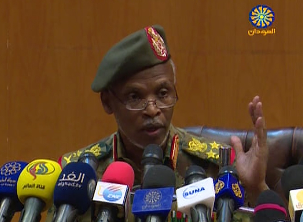 An image grab from a broadcast on Sudan TV shows Lieutenant General Omar Zain al-Abdin, the head of the political military committee assigned by the chief of the new military council, addressing a press conference on April 12, 2019 in the capital Khartoum