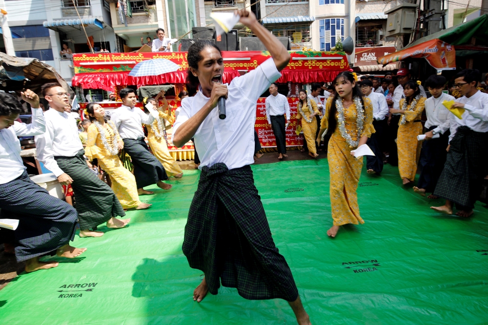 Students from Dagon University perform Burmese traditional slam poetry or thangyat during Burmese New Year in Yangon, Myanmar, April 13, 2019. Reuters/Ann Wang