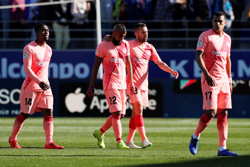 Barcelona players react after the match REUTERS/Albert Gea
