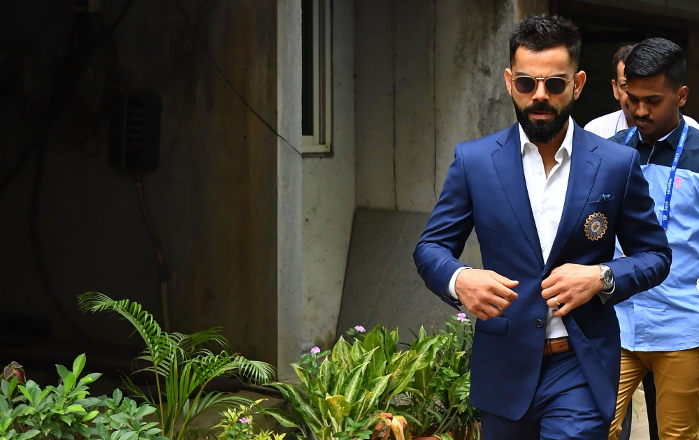 Indian cricket team captain Virat Kohli (C) leaves the Board of Control for Cricket in India (BCCI) headquarters after attending the ICC Cricket World Cup team selection meeting in Mumbai on April 15, 2019. (AFP / Indranil MUKHERJEE )