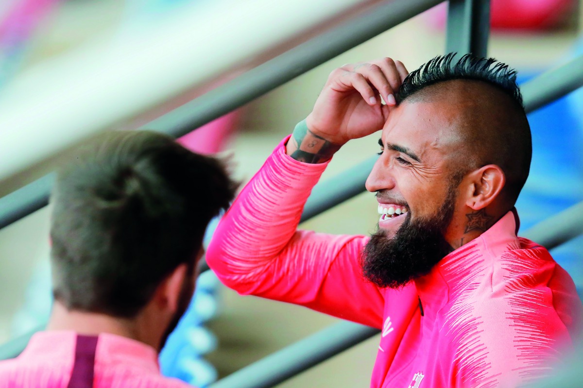 Barcelona's Spanish defender Gerard Pique (L) and Barcelona's Chilean midfielder Arturo Vidal attend a training session at the Joan Gamper Sports Center in Sant Joan Despi on April 15, 2019 on the eve of the Champions League second leg quarter-final footb