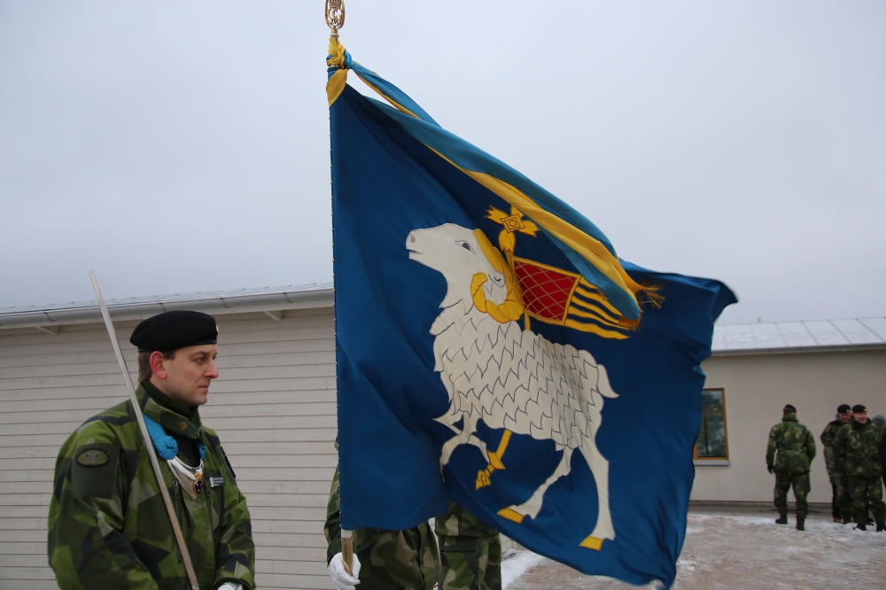Members of the Swedish Army’s Gotland Regiment hold the unit’s flag on a parade ground near the town of Visby on February 5, 2019, ahead of a commemoration of the unit’s founding.AFP / Tom Little